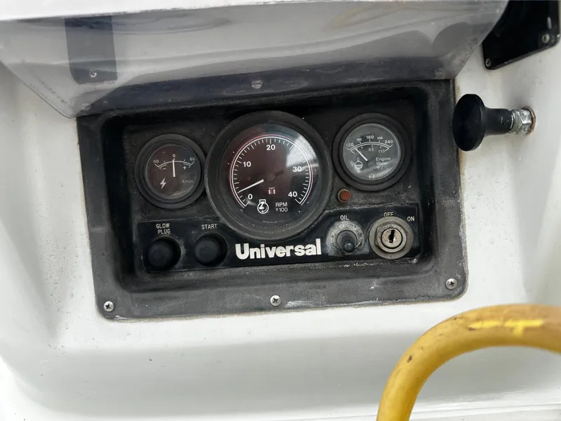 Slide: The Image of Control panel of a 1987 Ericson 34 2 sailboat with Universal engine gauges. - 34