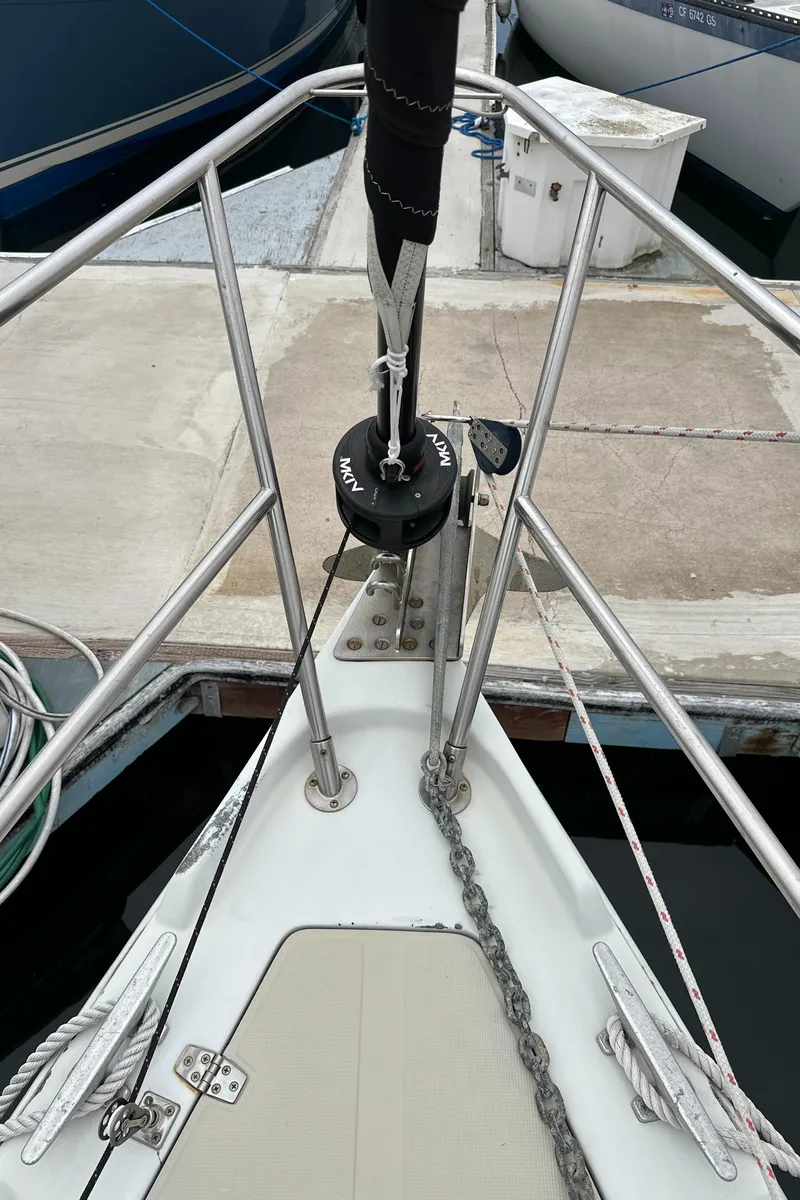 Slide: The Image of Bow of 1987 Ericson 34 2 sailboat with anchor chain and deck fittings. - 38