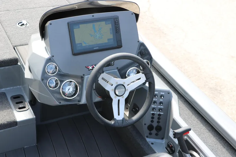 Slide: The Image of 2025 Vexus AVX1980 boat dashboard with steering wheel and navigation display. - 27