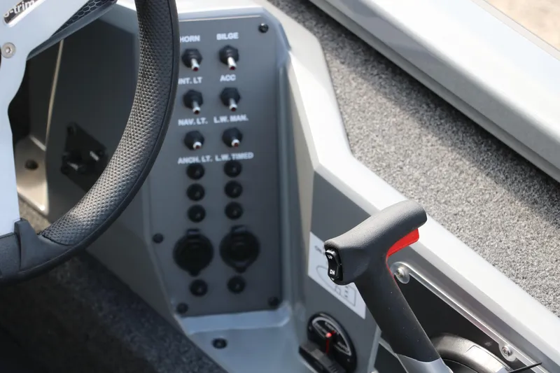 Slide: The Image of 2025 Vexus AVX1980 boat dashboard with steering wheel and control panel. - 28
