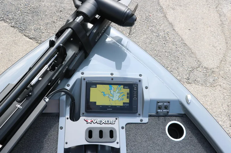 Slide: The Image of 2025 Vexus AVX1980 boat dashboard with Garmin navigation system and trolling motor. - 31