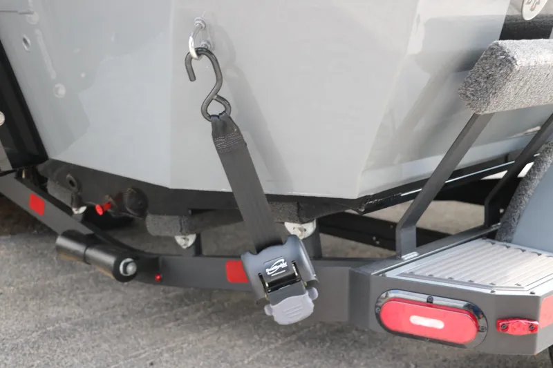 Slide: The Image of 2025 Vexus AVX1980 boat trailer with secure strap and hook mechanism. - 33