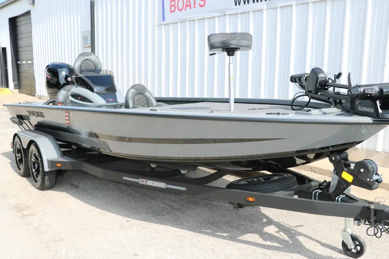 Slide: The Image of 2025 Vexus AVX1980 boat on trailer, featuring Garmin equipment, parked outside a building. - 4