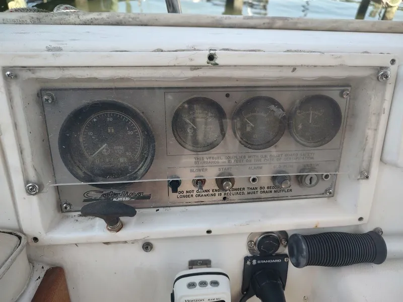 Slide: The Image of Control panel of a 1986 Catalina C-34 sailboat with gauges and switches. - 20