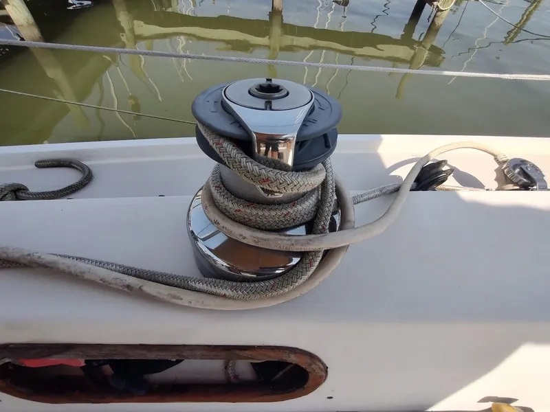 Slide: The Image of Winch with rope on 1986 Catalina C-34 sailboat deck, dockside view. - 27