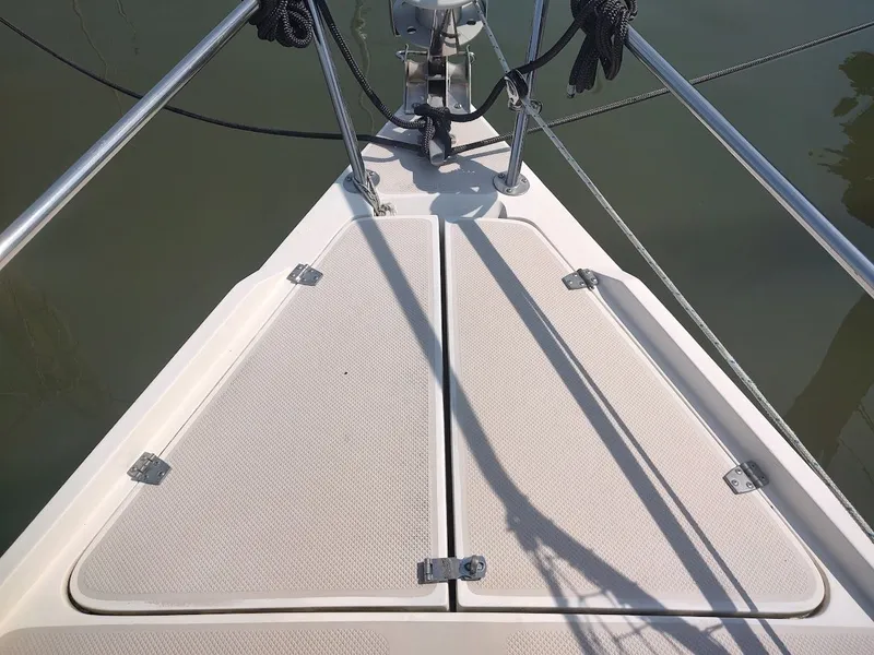 Slide: The Image of Bow of 1986 Catalina C-34 sailboat with deck hatches and railing. - 7