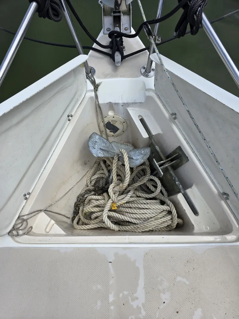 Slide: The Image of Anchor and rope in the bow compartment of a 1986 Catalina C-34 sailboat. - 8