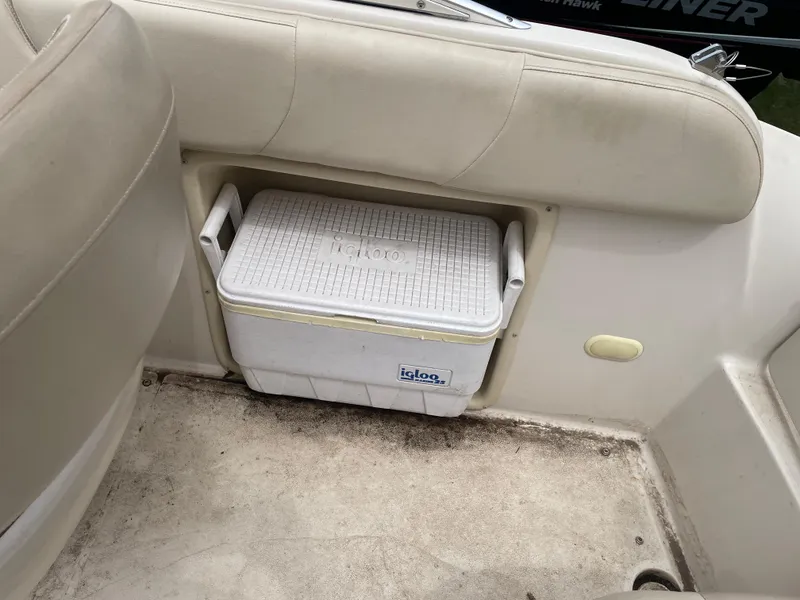 Slide: The Image of 2003 Larson 214 boat interior with Igloo cooler storage compartment. - 9