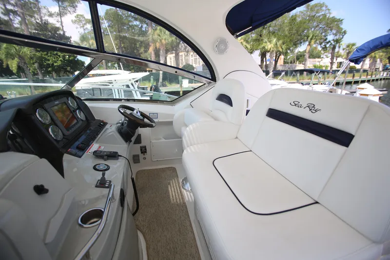 Slide: The Image of Interior of 2010 Sea Ray 390 Sundancer yacht with helm and seating area. - 10