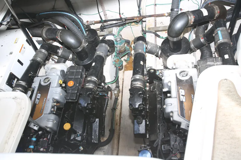 Slide: The Image of Engine room of 2010 Sea Ray 390 Sundancer with dual engines and complex piping system. - 30