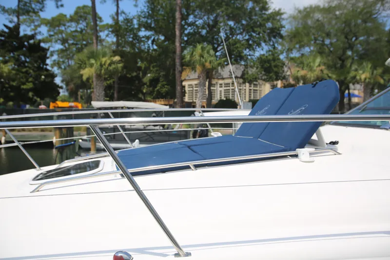 Slide: The Image of 2010 Sea Ray 390 Sundancer yacht with blue sun pads on deck. - 7