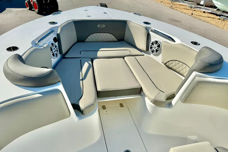 Slide: The Image of 2025 Key West 291 FS boat interior with cushioned seating and speakers. - 15