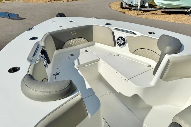 Slide: The Image of 2025 Key West 291 FS boat interior with cushioned seating and speaker system. - 16