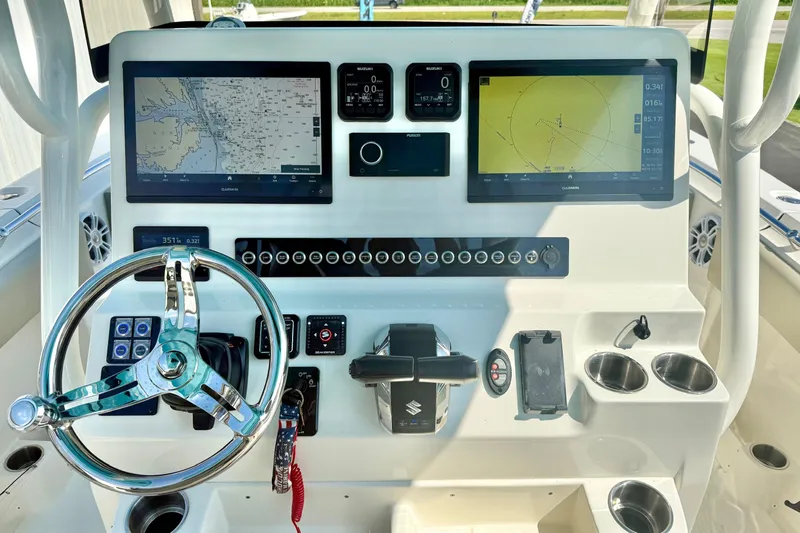 Slide: The Image of 2025 Key West 291 FS boat dashboard with advanced navigation and control systems. - 2