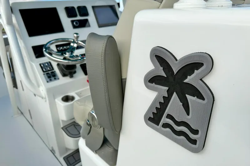 Slide: The Image of 2025 Key West 291 FS boat dashboard with palm tree emblem. - 26