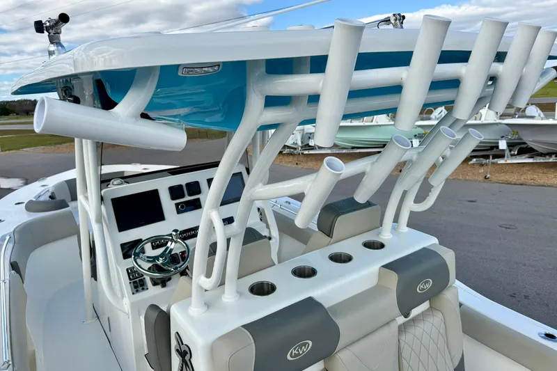 Slide: The Image of 2025 Key West 291 FS boat interior with rod holders and modern dashboard. - 28