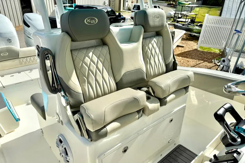 Slide: The Image of 2025 Key West 291 FS boat with luxurious dual captain's seats and modern helm controls. - 29