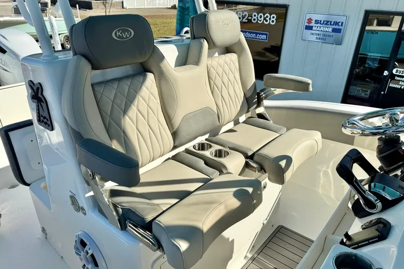 Slide: The Image of 2025 Key West 291 FS boat interior with luxurious seating and steering wheel. - 30