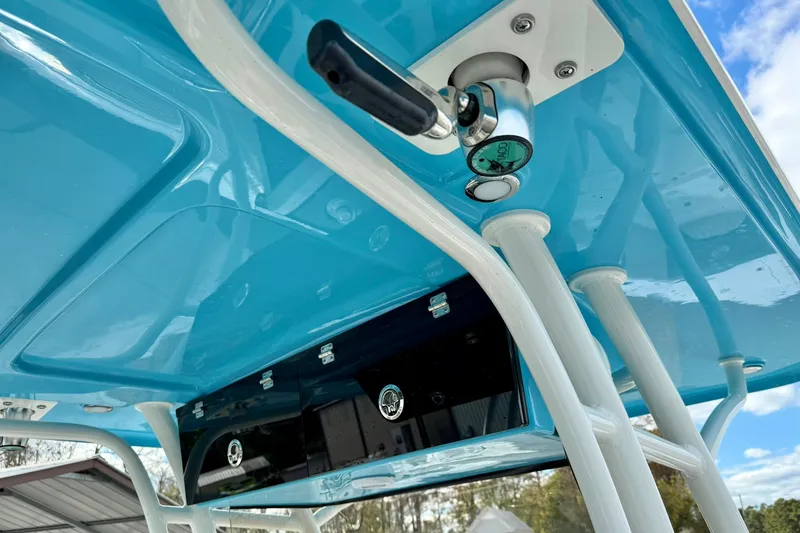 Slide: The Image of 2025 Key West 291 FS boat with blue T-top and rod holders. - 40