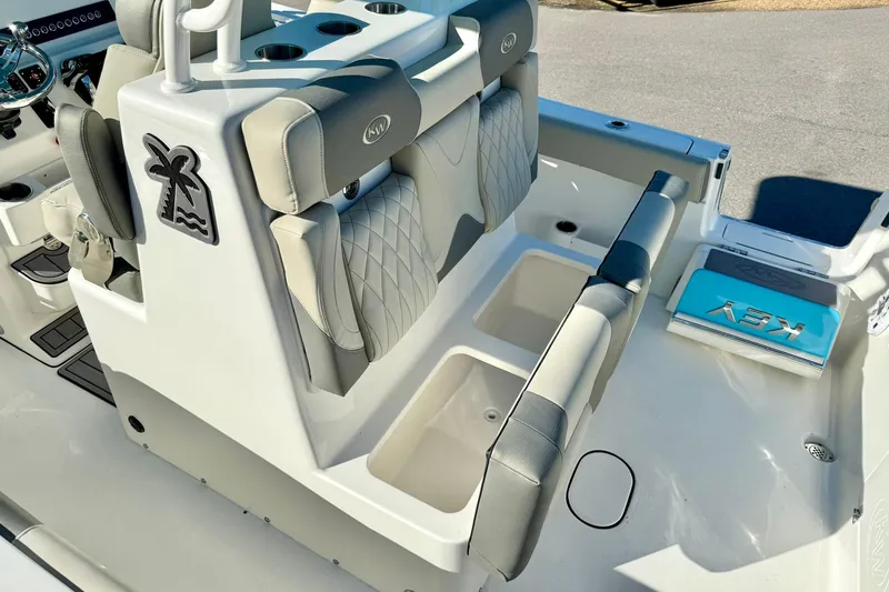 Slide: The Image of 2025 Key West 291 FS boat interior with cushioned seating and storage compartments. - 50