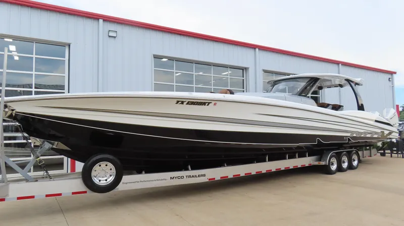 Slide: The Image of 2022 MTI 50v boat on trailer outside a modern building. - 1