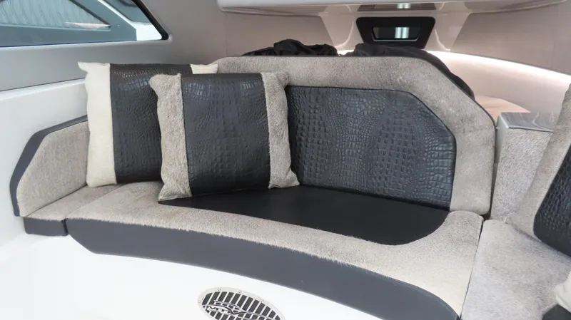 Slide: The Image of Luxurious interior seating with textured cushions in a 2022 MTI 50v boat. - 10