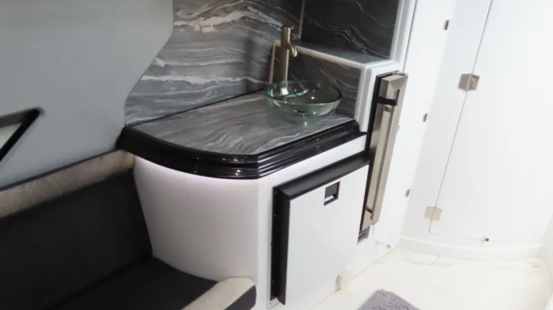 Slide: The Image of Luxurious MTI 50v 2022 yacht interior with sleek sink and modern cabinetry. - 11