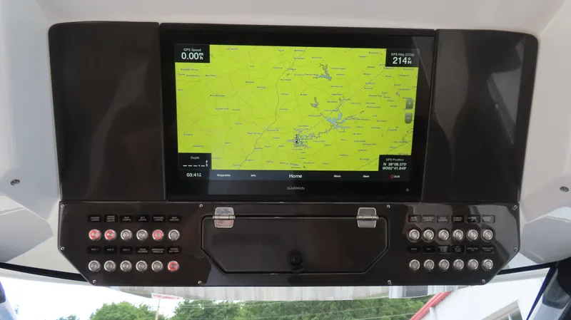 Slide: The Image of Control panel with GPS display on 2022 MTI 50v boat, showing navigation map and buttons. - 17