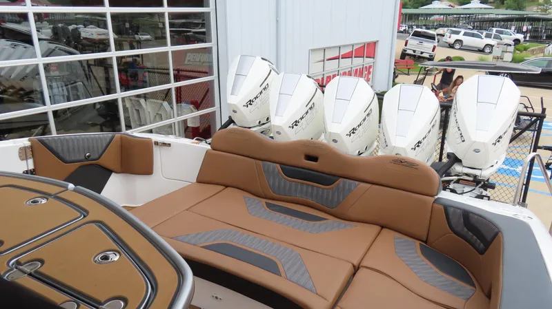 Slide: The Image of Luxury MTI 50v boat interior with brown seating and powerful outboard engines, 2022 model. - 20