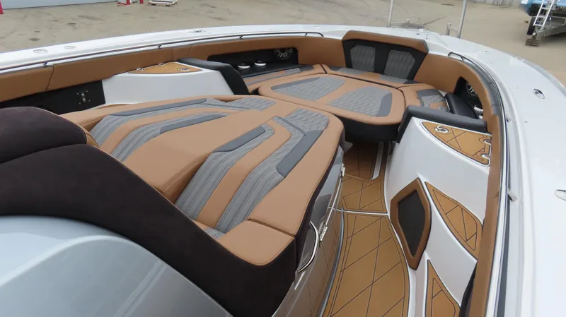 Slide: The Image of Luxurious MTI 50v 2022 boat interior with stylish brown and gray seating. - 30