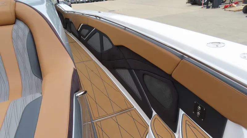 Slide: The Image of Luxurious interior of 2022 MTI 50v boat with tan and gray seating. - 38