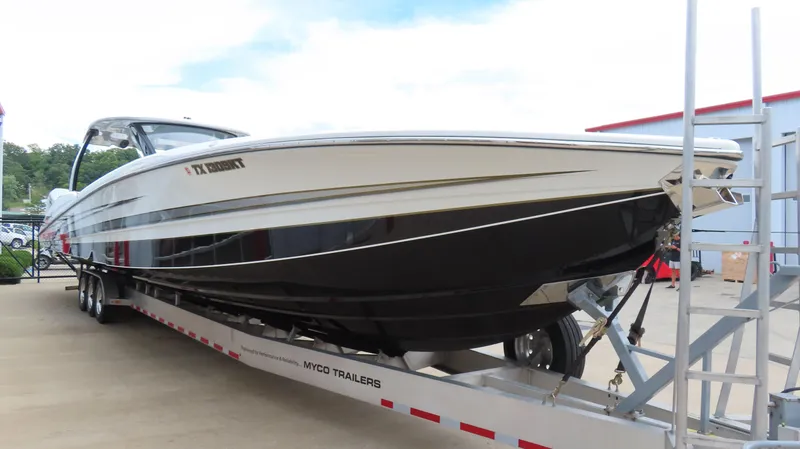 Slide: The Image of 2022 MTI 50v boat on Myco trailer, parked outdoors. - 41
