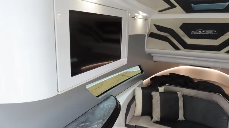 Slide: The Image of Luxurious interior of 2022 MTI 50v boat with modern TV and plush seating. - 8