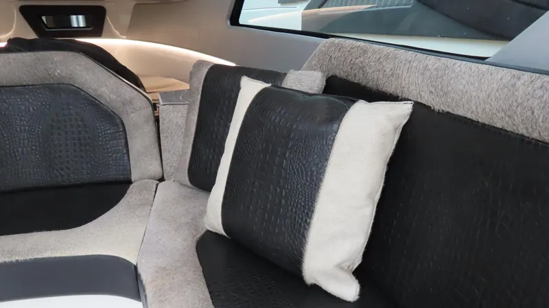 Slide: The Image of Luxurious interior seating of 2022 MTI 50v with plush cushions and sleek design. - 9