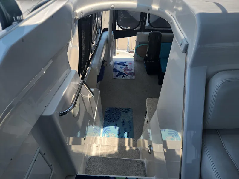 Slide: The Image of Interior view of 2000 Silverton 453 Motor Yacht with carpeted steps and seating area. - 25