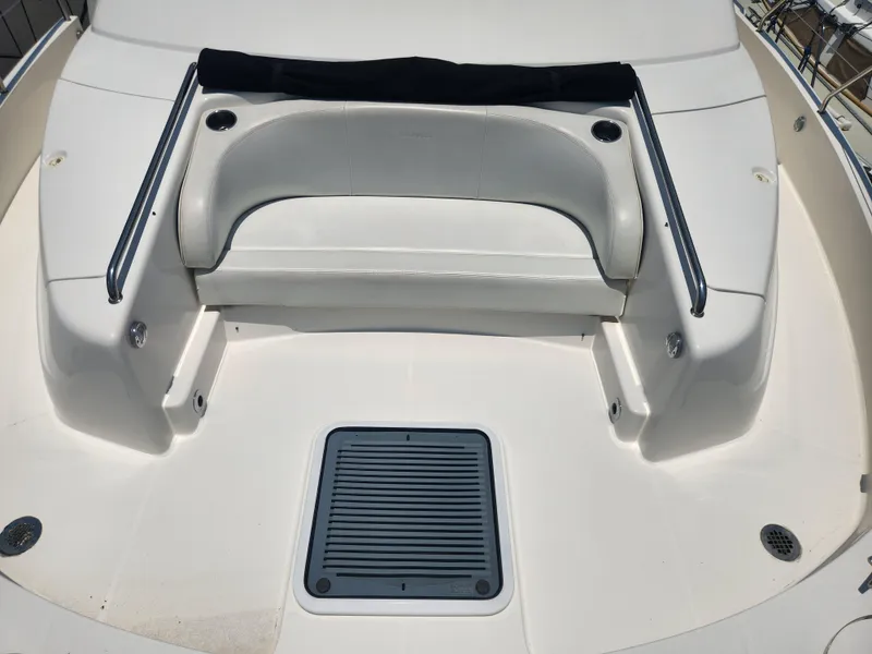 Slide: The Image of 2000 Silverton 453 Motor Yacht deck with seating and cup holders. - 32