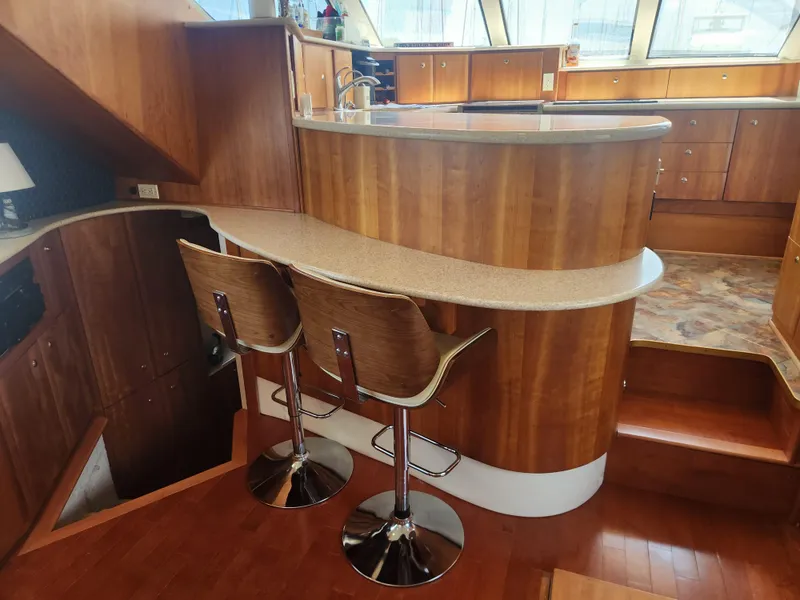 Slide: The Image of Interior of 2000 Silverton 453 Motor Yacht with modern design and ample natural light. - 47