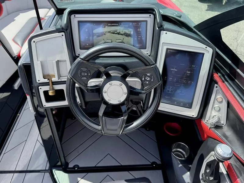 Slide: The Image of 2019 Supra SE550 boat dashboard with steering wheel and digital displays. - 11