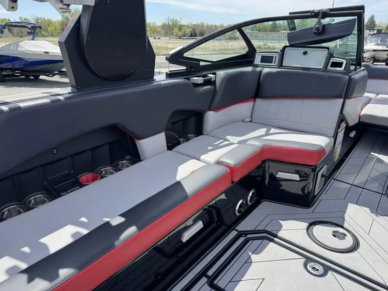 Slide: The Image of 2019 Supra SE550 boat interior with sleek seating, modern design, and advanced dashboard features. - 9