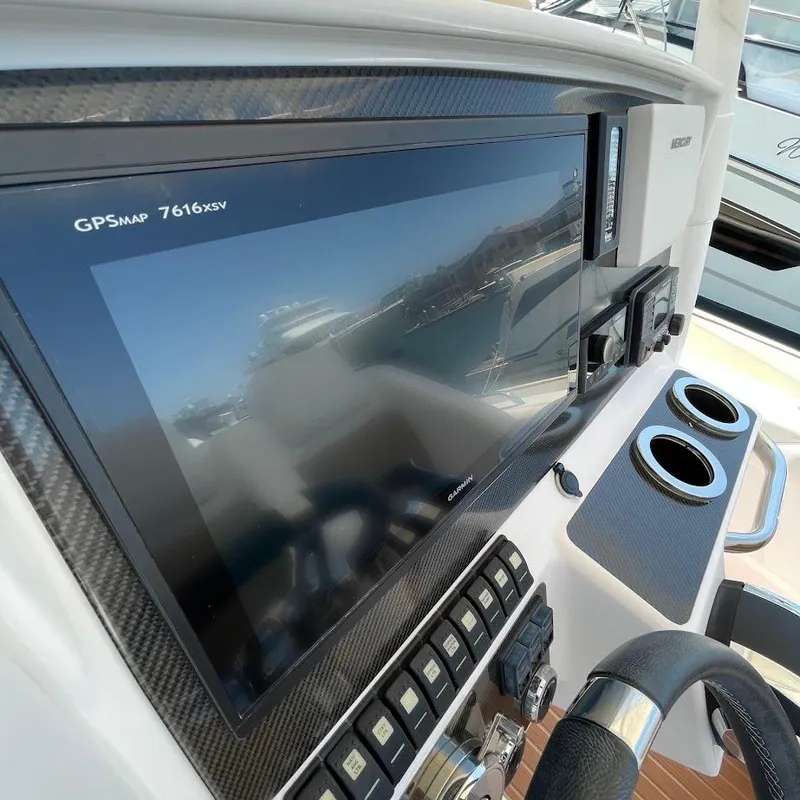 Slide: The Image of Boat dashboard with GPS display and controls, Airship 330, 2016 model. - 11
