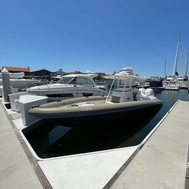 Slide: The Image of 2016 Airship 330 boat docked at marina under clear blue sky. - 15