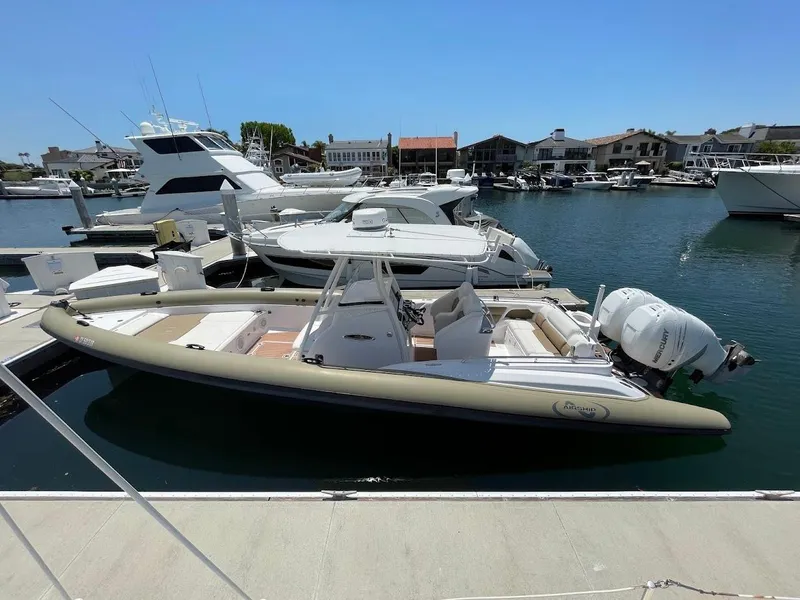 Slide: The Image of 2016 Airship 330 boat docked in a marina, surrounded by other vessels. - 16