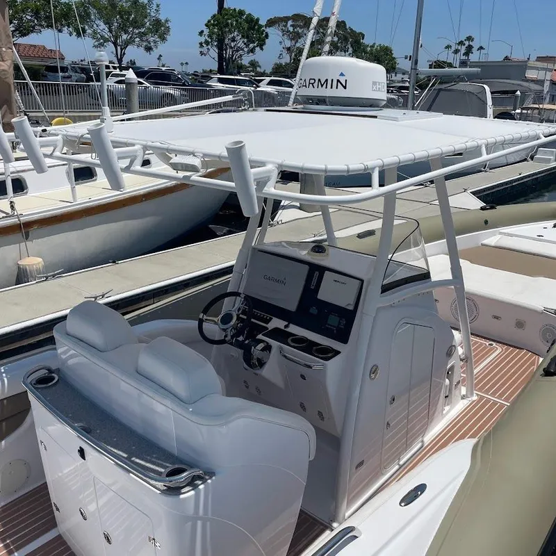Slide: The Image of Airship 330 boat cockpit with Garmin navigation, docked at marina, 2016 model. - 5