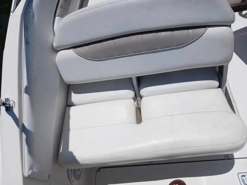 Slide: The Image of White leather seating on a 2004 Regal 2760 Commodore boat. - 6