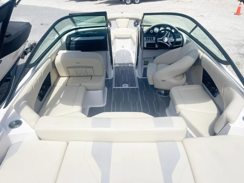 Slide: The Image of 2021 Regal 2000 ES Bowrider interior with beige seating and modern dashboard. - 5