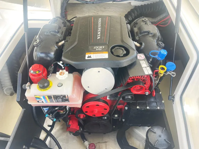Slide: The Image of 2021 Regal 2000 ES Bowrider engine compartment with Volvo Penta 200 V6 engine. - 8