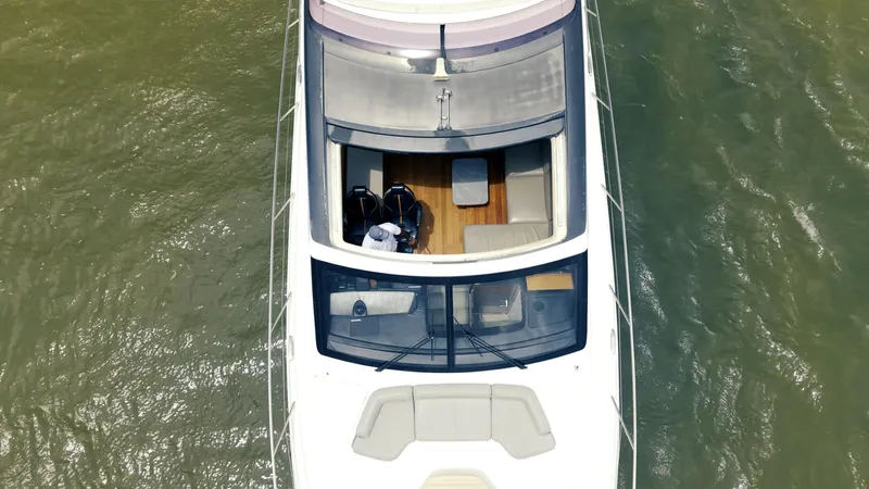 Slide: The Image of Aerial view of 2020 Princess S62 yacht on water, showcasing deck and seating area. - 14