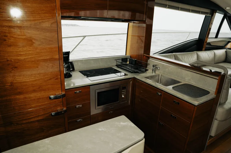 Slide: The Image of Luxurious kitchen interior of 2020 Princess S62 yacht with modern appliances and wood finish. - 30