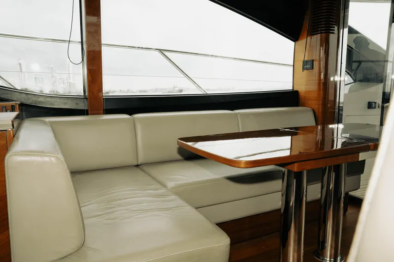 Slide: The Image of Luxurious interior of 2020 Princess S62 yacht with elegant seating and polished wooden table. - 31