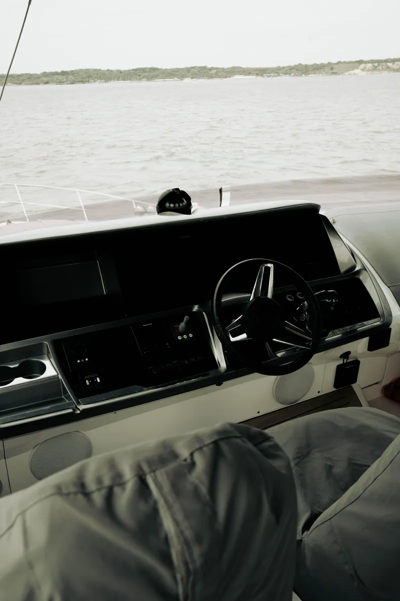 Slide: The Image of Interior view of 2020 Princess S62 yacht helm with steering wheel and navigation controls. - 35